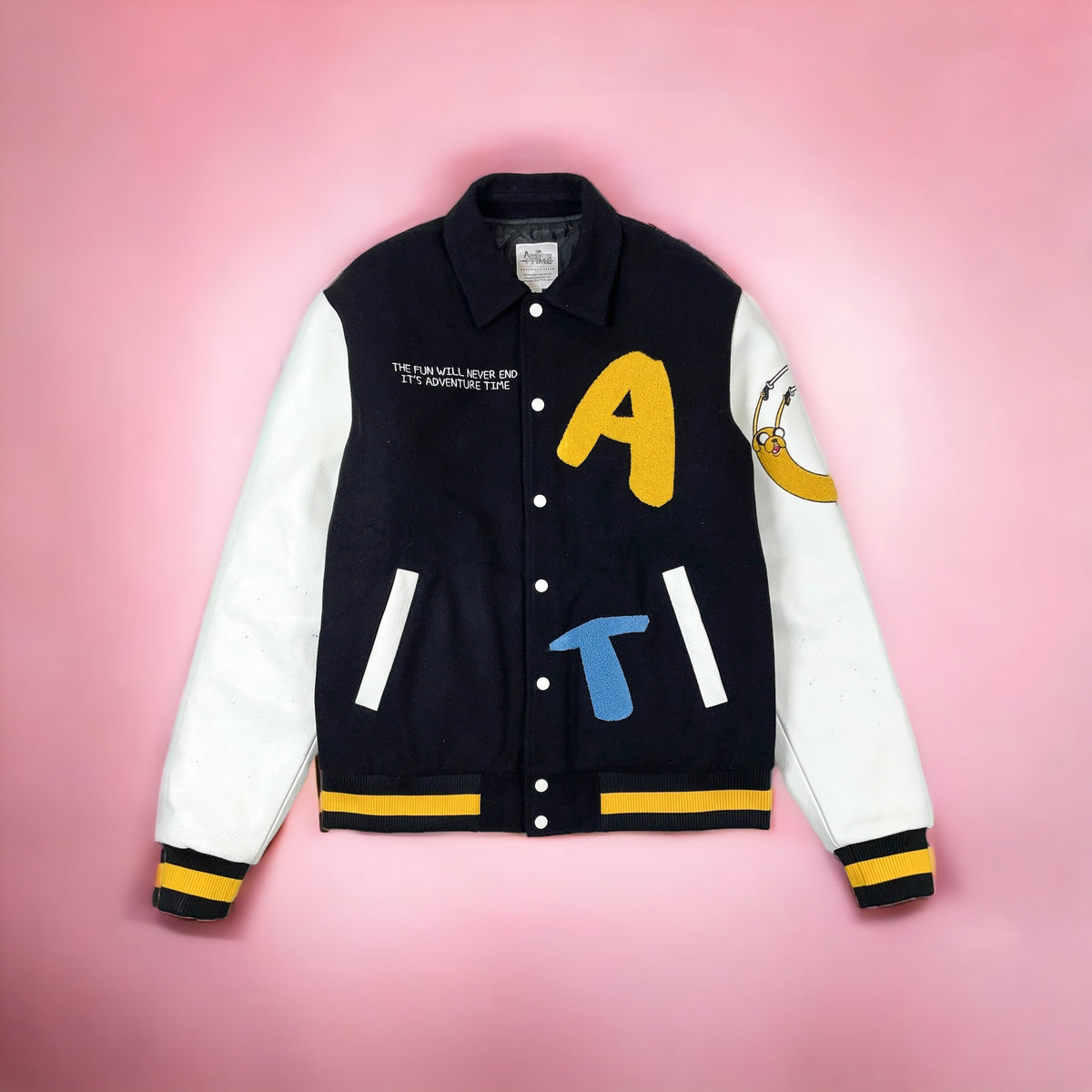 Full front of the Collectors Edition jacket, with black body, cream leather sleeves and yellow-striped ribbing